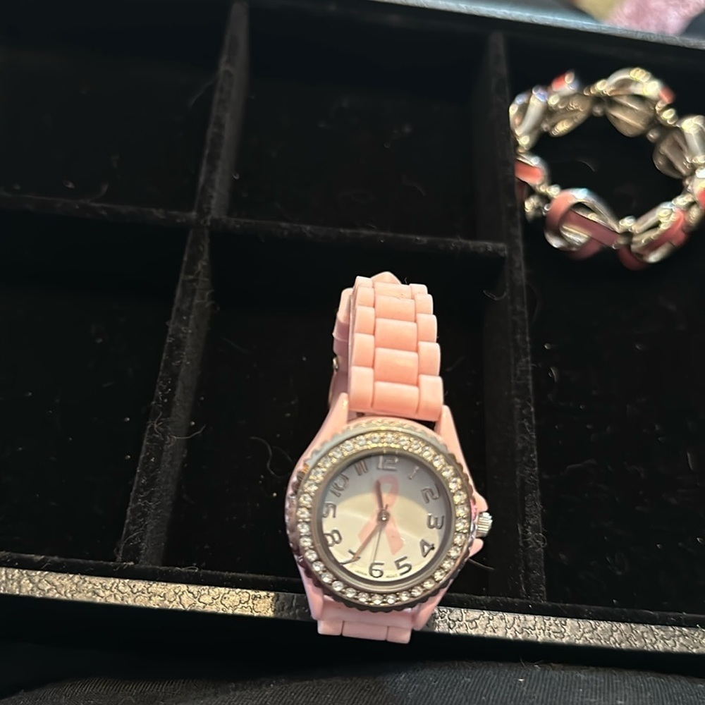 Breast cancer awareness watch. The brand is Geneva. Does need a battery.​​